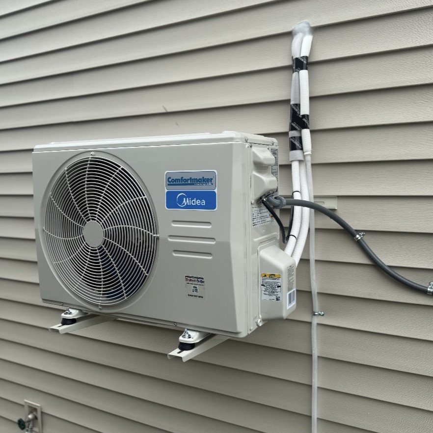 Professional Heating and Cooling technician diagnosing an issue during an AC repair service.